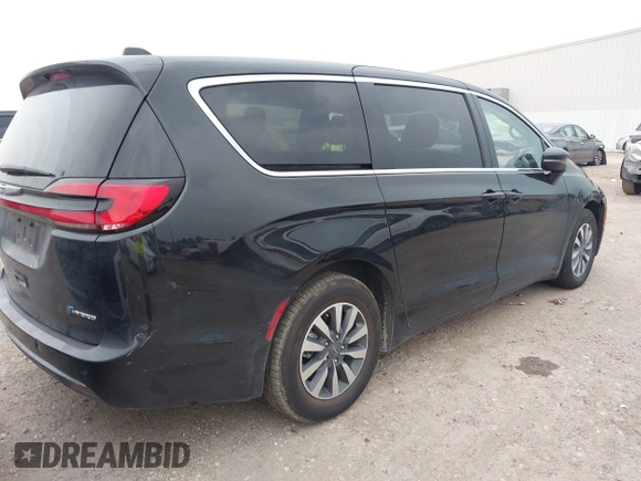 2023 Chrysler Pacifica Hybrid Touring L z VIN 2C4RC1L77PR631132, wystawiony jako IAAI lot #42391834 z przebiegiem 61 868 mil mil oraz . Historia ofert i sprzedaży dostępna na DreamBid. Obrazek 4.