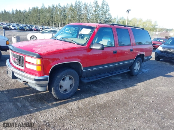 1996 GMC Suburban with VIN 1GKFK16R4TJ742646, listed as a IAAI auction lot 42004439 with 196,923 mi miles. Bid and sale history available at carsss.com. Image 2.