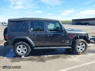 2018 Jeep Wrangler Unlimited Sport S with VIN 1C4HJXDG4JW149557, listed as a IAAI auction lot 42014833 with 54,472 mi miles. Bid and sale history available at carsss.com. Image 14.