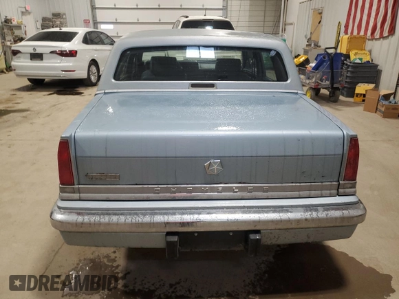 1989 Chrysler New Yorker z VIN 1C3BC663XKD578434, wystawiony jako Copart lot #84945044 z przebiegiem 51 067 mil mil oraz Szkody całkowita. Historia ofert i sprzedaży dostępna na DreamBid. Obrazek 6.