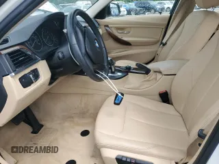 2014 BMW 3 Series 320i xDrive with VIN WBA3C3G50ENS67198, listed as a Copart auction lot 61654205 with 86,126 mi miles and Salvage title. Bid and sale history available at DreamBid. Image 7.