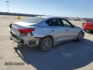 2014 Infiniti Q50 Hybrid Premium with VIN JN1AV7AP1EM692234, listed as a Copart auction lot 48697525 with 104,586 mi miles and Salvage Title. Bid and sale history available at DreamBid. Image 3.