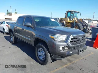 2018 Toyota Tacoma SR with VIN 5TFAX5GN5JX121405, listed as a IAAI auction lot 41337448 with 128,788 mi miles and . Bid and sale history available at DreamBid. Image 1.