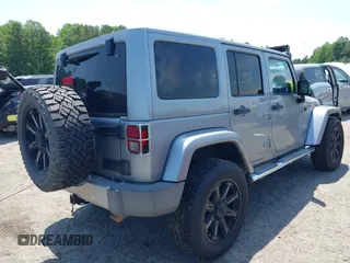 2013 Jeep Wrangler Unlimited Sahara with VIN 1C4BJWEG4DL666930, listed as a IAAI auction lot 42310569 with 206,577 mi miles and . Bid and sale history available at DreamBid. Image 4.