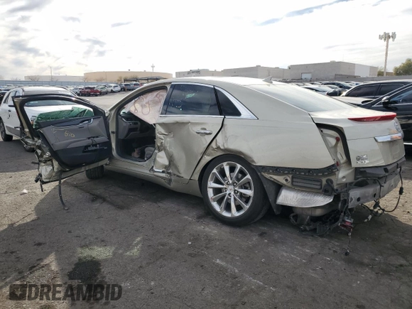 2014 Cadillac XTS Luxury with VIN 2G61M5S31E9314477, listed as a Copart auction lot 43562705 with 136,469 mi miles and Salvage Title. Bid and sale history available at DreamBid. Image 2.