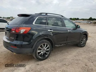2015 Mazda CX-9 Grand Touring z VIN JM3TB2DA3F0452322, wystawiony jako Copart lot #57821285 z przebiegiem 147 610 mil mil oraz Czysty tytuł • Clean title. Historia ofert i sprzedaży dostępna na DreamBid. Obrazek 3.