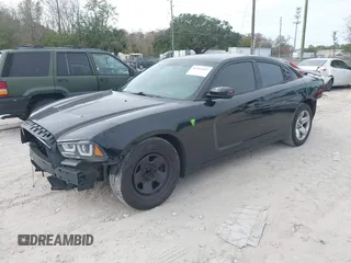 2012 Dodge Charger Police z VIN 2C3CDXAT6CH305154, wystawiony jako IAAI lot #41366892 z przebiegiem 155 824 mil mil oraz . Historia ofert i sprzedaży dostępna na DreamBid. Obrazek 2.