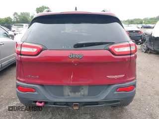 2015 Jeep Cherokee Trailhawk with VIN 1C4PJMBS6FW575517, listed as a IAAI auction lot 42661199 with 299,166 mi miles and . Bid and sale history available at DreamBid. Image 16.