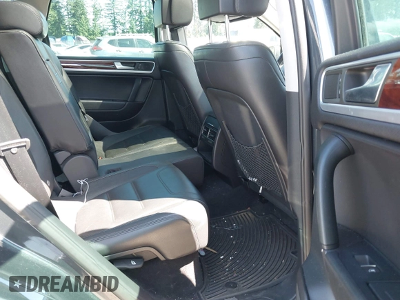 2012 Volkswagen Touareg Sport with VIN WVGFK9BP0CD004951, listed as a IAAI auction lot 42724125 with 173,993 mi miles and . Bid and sale history available at DreamBid. Image 8.