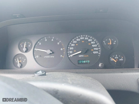 2003 Jeep Grand Cherokee Laredo with VIN 1J8GW48S63C596866, listed as a IAAI auction lot 42060430 with 129,849 mi miles. Bid and sale history available at carsss.com. Image 7.