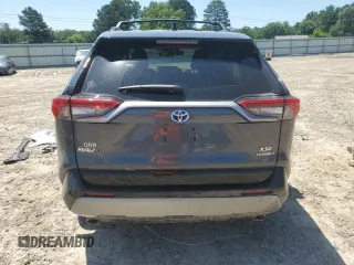2023 Toyota RAV4 Hybrid XSE with VIN 2T3E6RFV9PW039963, listed as a Copart auction lot 57594335 with 27,486 mi miles and Salvage title. Bid and sale history available at DreamBid. Image 6.