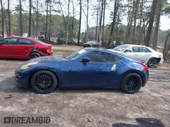 2014 Nissan 370Z Nismo z VIN JN1AZ4EH0EM631950, wystawiony jako IAAI lot #41685567 z przebiegiem 103 282 mil mil oraz . Historia ofert i sprzedaży dostępna na DreamBid. Obrazek 14.