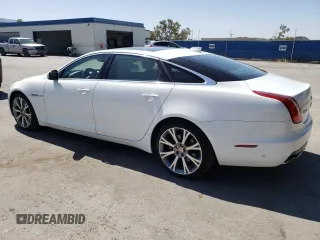 2019 Jaguar XJ Portfolio with VIN SAJWA2G72K8W21087, listed as a Copart auction lot 66017344 with 22,671 mi miles and Salvage Title. Bid and sale history available at DreamBid. Image 2.