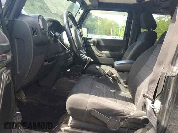 2012 Jeep Wrangler Sport with VIN 1C4AJWAG6CL256792, listed as a Copart auction lot 62634515 with 137,507 mi miles and Salvage title. Bid and sale history available at DreamBid. Image 7.