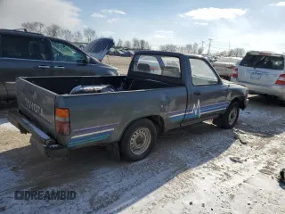 1990 Toyota Pickup z VIN JT4RN81R3L0056975, wystawiony jako Copart lot #88053235 z przebiegiem 144 149 mil mil oraz Tytuł czysty. Historia ofert i sprzedaży dostępna na DreamBid. Obrazek 3.