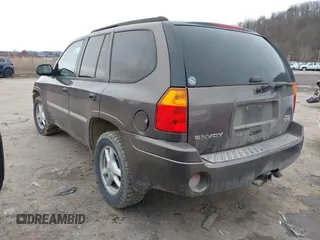 2008 GMC Envoy SLE2 with VIN 1GKDT13S482236375, listed as a IAAI auction lot 41510610 with 183,716 mi miles. Bid and sale history available at carsss.com. Image 3.