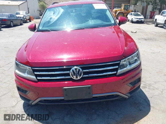 2018 Volkswagen Tiguan S with VIN 3VV1B7AX4JM043324, listed as a IAAI auction lot 42623550 with 62,858 mi miles and . Bid and sale history available at DreamBid. Image 12.