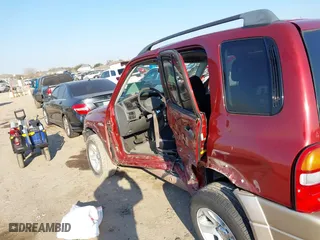 2002 Suzuki Grand Vitara JLX with VIN JS3TD62V824152943, listed as a IAAI auction lot 41668395 with 104,191 mi miles. Bid and sale history available at carsss.com. Image 6.