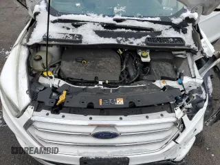 2018 Ford Escape SE z VIN 1FMCU9GD5JUB12877, wystawiony jako Copart lot #51973295 z przebiegiem 121 698 mil mil oraz Szkoda całkowita • Salvage title. Historia ofert i sprzedaży dostępna na DreamBid. Obrazek 11.