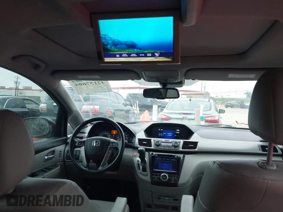 2016 Honda Odyssey Touring Elite with VIN 5FNRL5H96GB063176, listed as a IAAI auction lot 42157604 with 106,177 mi miles. Bid and sale history available at carsss.com. Image 19.