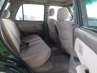 1999 Toyota 4Runner SR5 z VIN JT3GN86R4X0129944, wystawiony jako IAAI lot #41537597 z przebiegiem 361 416 mil mil oraz . Historia ofert i sprzedaży dostępna na DreamBid. Obrazek 8.