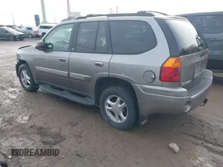 2005 GMC Envoy SLT with VIN 1GKDT13S752276414, listed as a IAAI auction lot 41052684 with 200,919 mi miles. Bid and sale history available at carsss.com. Image 3.
