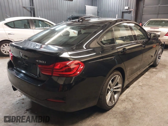 2018 BMW 4 Series 430i xDrive with VIN WBA4J3C56JBL03844, listed as a IAAI auction lot 40864200 with 56,115 mi miles and . Bid and sale history available at DreamBid. Image 4.
