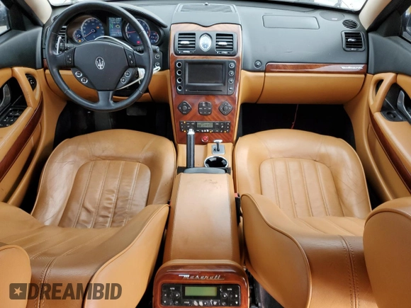2005 Maserati Quattroporte z VIN ZAMCE39A050017377, wystawiony jako Copart lot #50191415 z przebiegiem 39 545 mil mil oraz Czysty tytuł • Clean title. Historia ofert i sprzedaży dostępna na DreamBid. Obrazek 8.