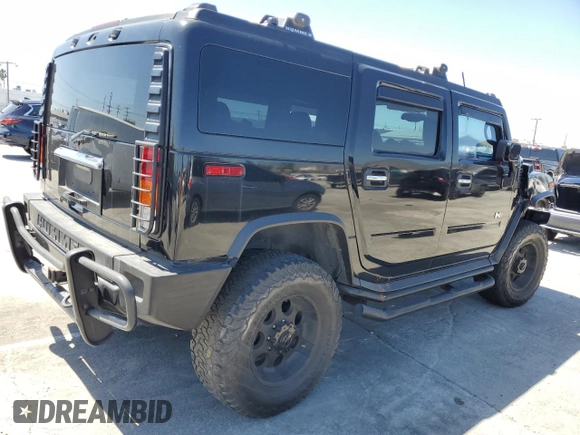 2003 Hummer H2 with VIN 5GRGN23U73H122529, listed as a Copart auction lot 50157934 with 0 mi miles and Salvage Title. Bid and sale history available at carsss.com. Image 3.