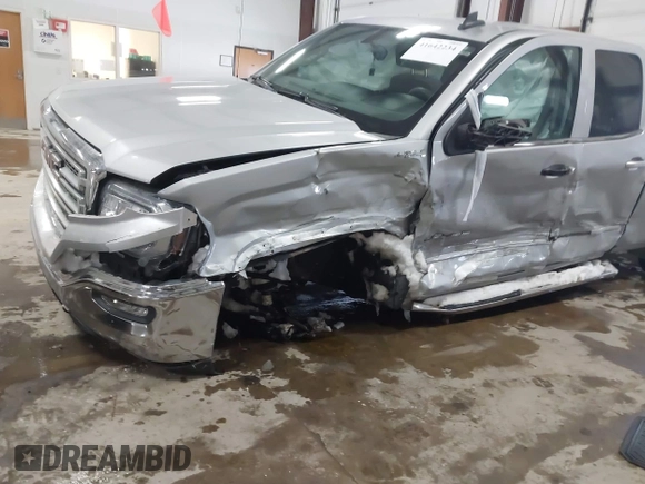 2018 GMC Sierra 1500 SLE z VIN 1GTV2MEH8JZ357073, wystawiony jako IAAI lot #41642234 z przebiegiem 105 007 mil mil oraz . Historia ofert i sprzedaży dostępna na DreamBid. Obrazek 6.