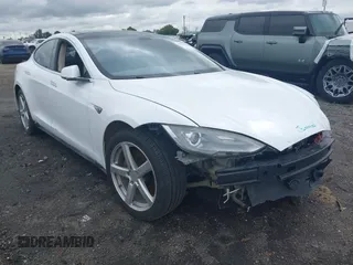 2013 Tesla Model S with VIN 5YJSA1CN0DFP31750, listed as a IAAI auction lot 41911343 with 209,664 mi miles and . Bid and sale history available at DreamBid. Image 1.