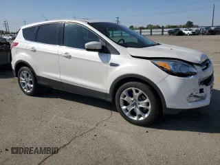 2013 Ford Escape SEL with VIN 1FMCU9H91DUC35459, listed as a Copart auction lot 55277545 with 130,081 mi miles and Salvage Title. Bid and sale history available at DreamBid. Image 4.