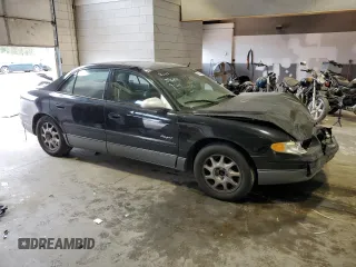 2000 Buick Regal GS with VIN 2G4WF5519Y1126067, listed as a Copart auction lot 70296503 with 216,502 mi miles and Salvage Title. Bid and sale history available at carsss.com. Image 4.