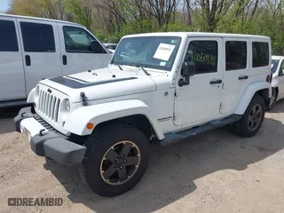 2012 Jeep Wrangler Unlimited Sahara with VIN 1C4HJWEG3CL254944, listed as a IAAI auction lot 42060981 with 172,358 mi miles. Bid and sale history available at carsss.com. Image 17.