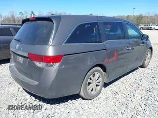 2014 Honda Odyssey EX-L with VIN 5FNRL5H61EB014695, listed as a IAAI auction lot 41694860 with 261,265 mi miles and . Bid and sale history available at DreamBid. Image 4.