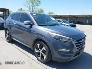 2018 Hyundai Tucson Sport z VIN KM8J33AL9JU827748, wystawiony jako IAAI lot #41981192 z przebiegiem 96 118 mil mil oraz . Historia ofert i sprzedaży dostępna na DreamBid. Obrazek 1.