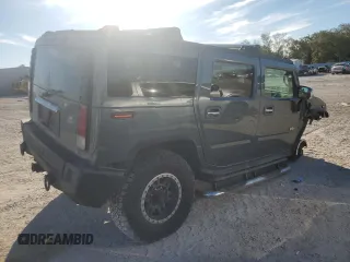 2005 Hummer H2 SUV with VIN 5GRGN23U25H115698, listed as a Copart auction lot 82569874 with 143,367 mi miles and Salvage Title. Bid and sale history available at carsss.com. Image 3.