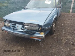 1991 Oldsmobile Delta z VIN 1G3HN54C6M1809377, wystawiony jako IAAI lot #42275221 z przebiegiem 139 509 mil mil oraz . Historia ofert i sprzedaży dostępna na DreamBid. Obrazek 6.