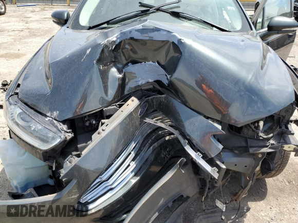 2015 Ford Fusion SE z VIN 3FA6P0H7XFR207923, wystawiony jako Copart lot #57637395 z przebiegiem Nie podano mil oraz Szkoda całkowita • Salvage title. Historia ofert i sprzedaży dostępna na DreamBid. Obrazek 11.