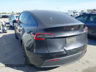 2025 Tesla Model Y Long Range with VIN 7SAYGDED2SF228414, listed as a IAAI auction lot 41706470 with 11,319 mi miles and . Bid and sale history available at DreamBid. Image 3.