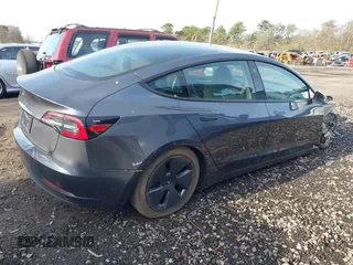 2023 Tesla Model 3 with VIN 5YJ3E1EAXPF666252, listed as a IAAI auction lot 42009929 with 27,328 mi miles and . Bid and sale history available at DreamBid. Image 4.