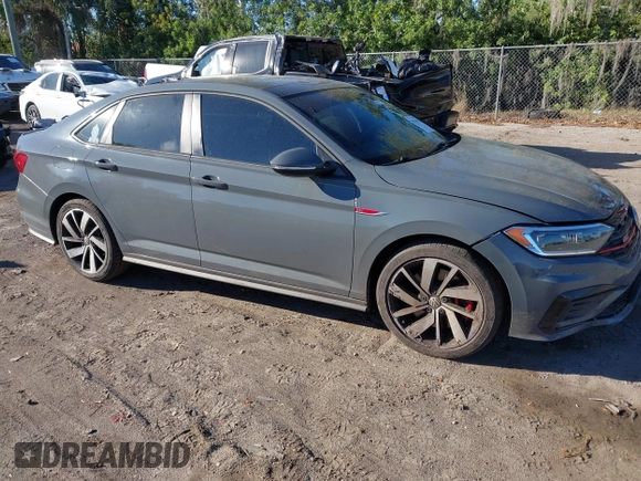 2019 Volkswagen Jetta GLI S z VIN 3VW6T7BU5KM169132, wystawiony jako IAAI lot #41599605 z przebiegiem 59 744 mil mil oraz . Historia ofert i sprzedaży dostępna na DreamBid. Obrazek 1.