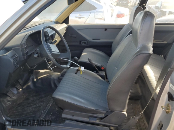 1986 Toyota Tercel z VIN JT2AL31G5G0429131, wystawiony jako Copart lot #79204554 z przebiegiem 124 477 mil mil oraz Szkoda całkowita • Salvage title. Historia ofert i sprzedaży dostępna na DreamBid. Obrazek 7.