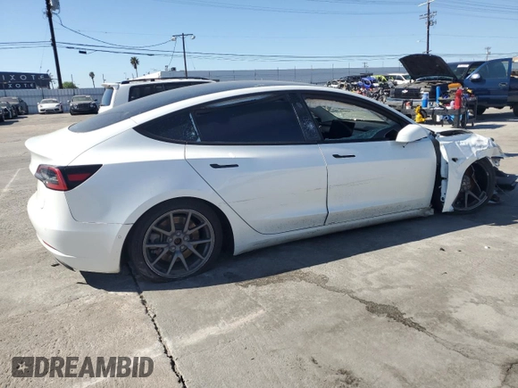 2021 Tesla Model 3 Standard Range Plus with VIN 5YJ3E1EA8MF874156, listed as a Copart auction lot 46323505 with Not Provided miles and Salvage Title. Bid and sale history available at DreamBid. Image 3.