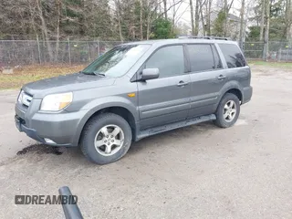 2007 Honda Pilot EX-L with VIN 2HKYF18667H526601, listed as a IAAI auction lot 42182710 with 221,948 mi miles and . Bid and sale history available at carsss.com. Image 2.
