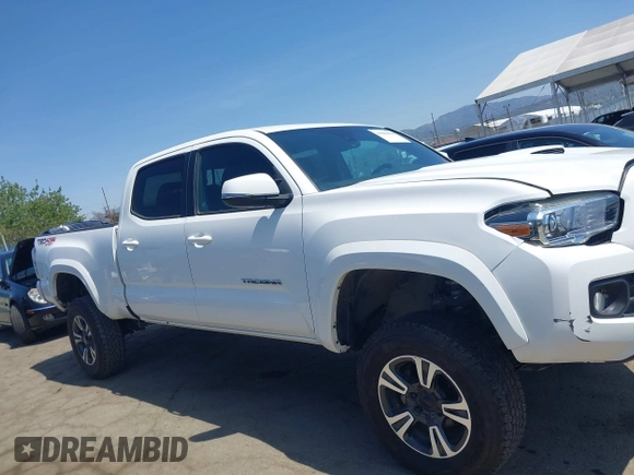 2021 Toyota Tacoma 4WD SR5 with VIN 3TMDZ5BN4MM106693, listed as a IAAI auction lot 41986838 with 52,510 mi miles. Bid and sale history available at carsss.com. Image 13.