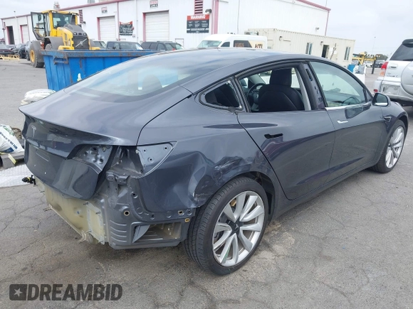 2018 Tesla Model 3 Long Range Battery with VIN 5YJ3E1EA8JF059385, listed as a IAAI auction lot 42116589 with 63,630 mi miles and . Bid and sale history available at DreamBid. Image 4.