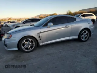 2005 Hyundai Tiburon GT z VIN KMHHN65F05U171038, wystawiony jako Copart lot #87765735 z przebiegiem 113 129 mil mil oraz Szkody całkowita. Historia ofert i sprzedaży dostępna na DreamBid. Obrazek 1.