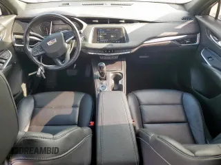 2021 Cadillac XT4 FWD Luxury z VIN 1GYAZAR49MF084676, wystawiony jako Copart lot #59765515 z przebiegiem 32 480 mil mil oraz Czysty tytuł • Clean title. Historia ofert i sprzedaży dostępna na DreamBid. Obrazek 8.