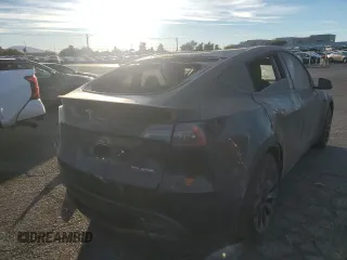 2023 Tesla Model Y Performance with VIN 7SAYGDEF5PF966796, listed as a Copart auction lot 88097325 with 6,927 mi miles and Salvage Title. Bid and sale history available at DreamBid. Image 3.
